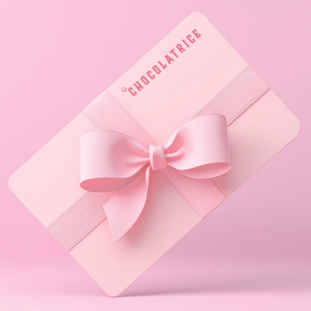 La Chocolatrice pink gift card with a bow, perfect for chocolate-making experiences and gifts. Ideal for gifting artisan chocolate workshops or chocolate bars. The gift card showcases a stylish design with the La Chocolatrice branding, making it a great option for corporate gifts or special occasions.