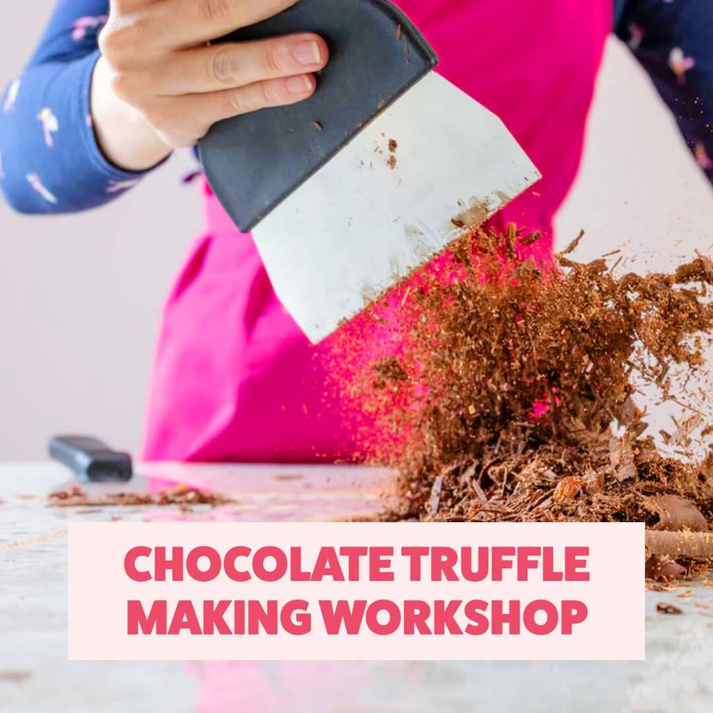 Close-up of chocolate shavings on a marble counter during a La Chocolatrice truffle-making experience.