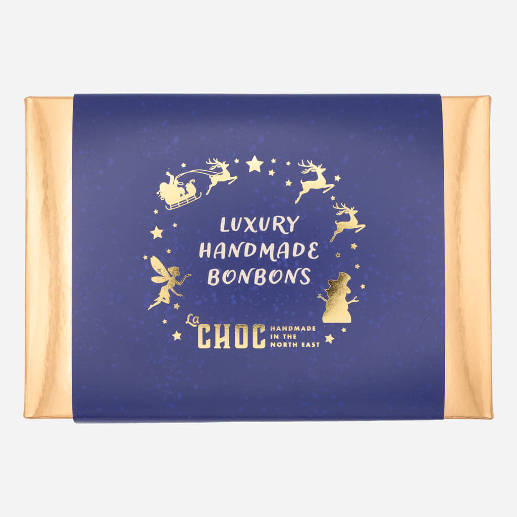 Blue La Chocolatrice luxury handmade bonbons gift box with gold foil Christmas design and fairy illustration.