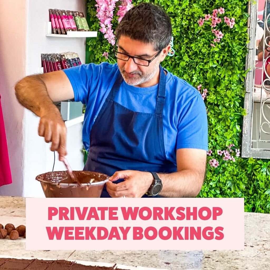 Guest stirring melted chocolate during a weekday private workshop at La Chocolatrice’s Durham chocolate school.