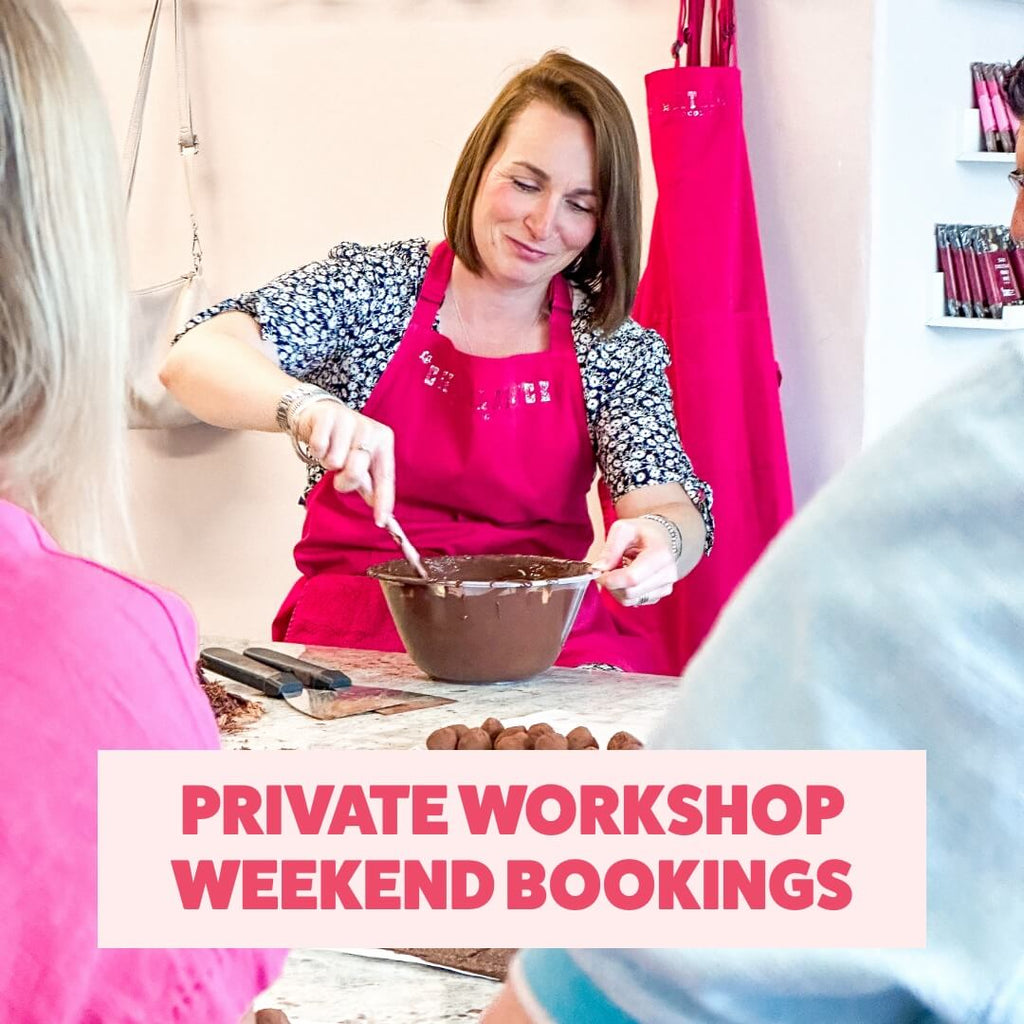 Instructor leading a private weekend chocolate workshop at La Chocolatrice, demonstrating truffle-making techniques.